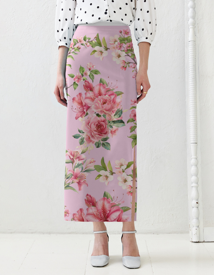 A woman wearing a long floral skirt featuring pink roses and other flowers, paired with a black and white polka dot blouse and gray heels.